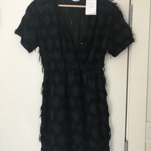 Party cocktail dress with fringe effect